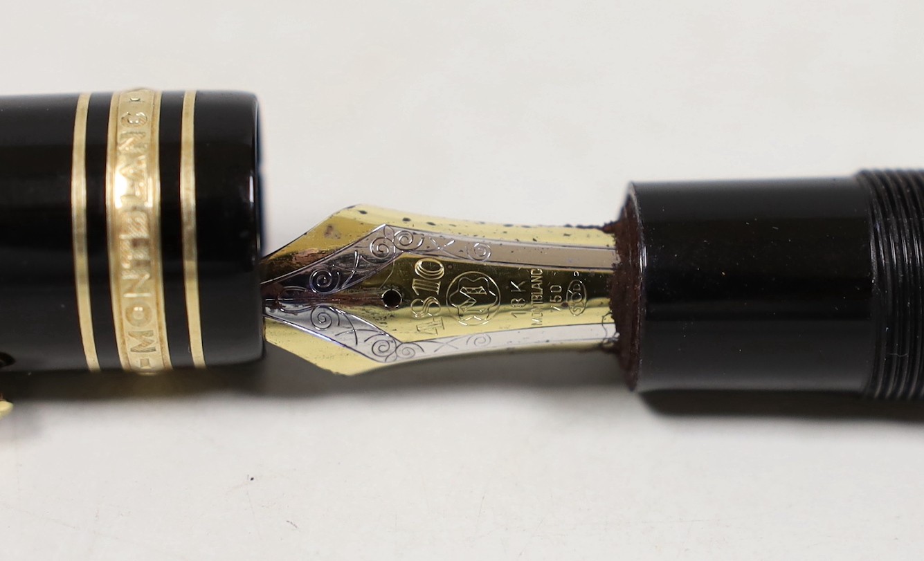 A Montblanc Meisterstuck no.149 fountain pen and a red crocodile pattern leather case